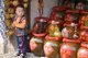 China: Boy at a local alcohol shop near the North Gate Tower, Fenghuang, Hunan Province