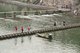 China: Stepping stones and wooden bridge across the Tuo River, Fenghuang, Hunan Province
